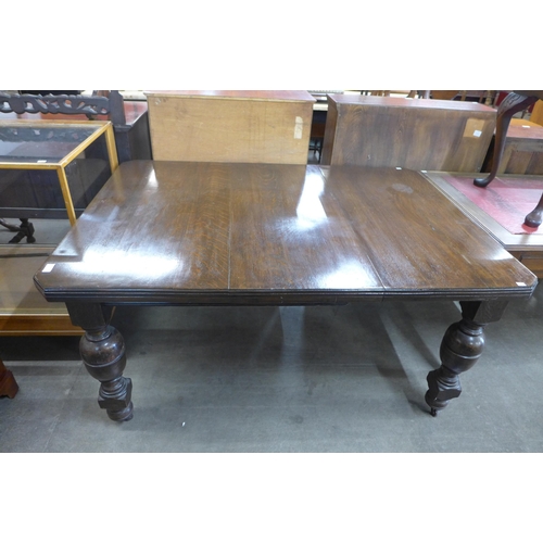 178 - A Victorian oak dining table and an early 20th Century oak sideboard