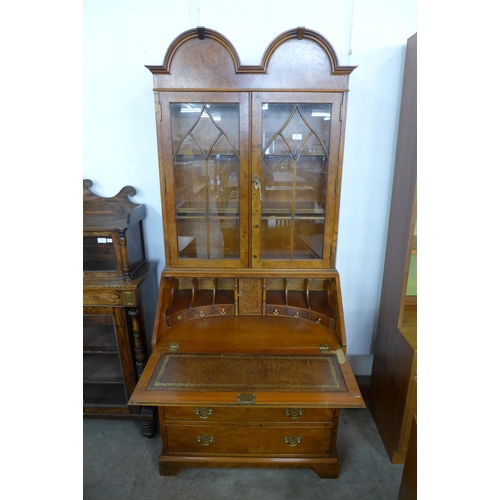 180 - A George I style burr elm bureau bookcase