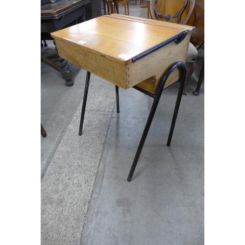 186 - A child's pine and steel school desk