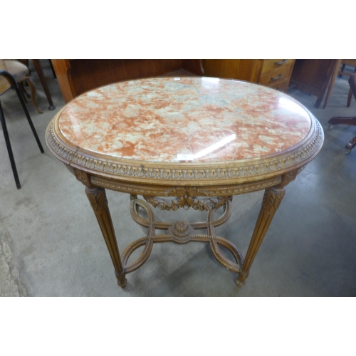 190 - A French Louis XV style carved wood and marble topped oval gueridon table