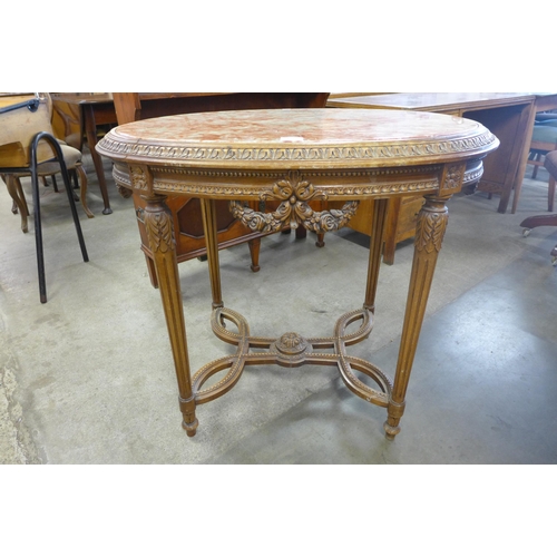 190 - A French Louis XV style carved wood and marble topped oval gueridon table