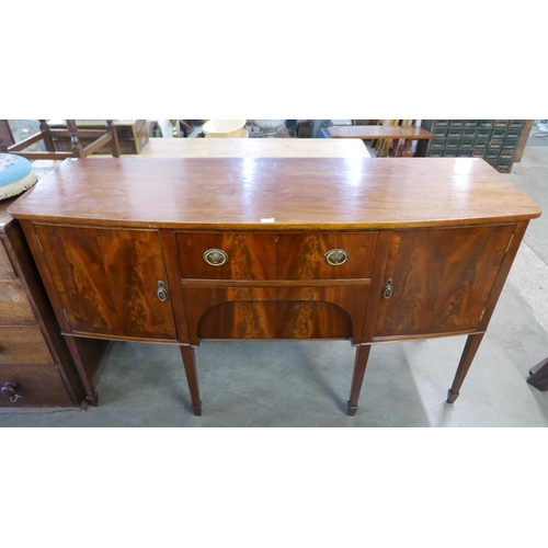 206 - A Regency style mahogany bow front sideboard