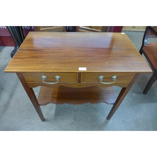 21 - A George IV style inlaid mahogany two drawer side table