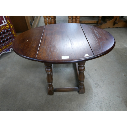 218 - An oak drop-leaf occasional table