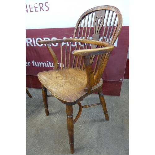 22 - A pair of 19th Century elm and yew Windsor chairs