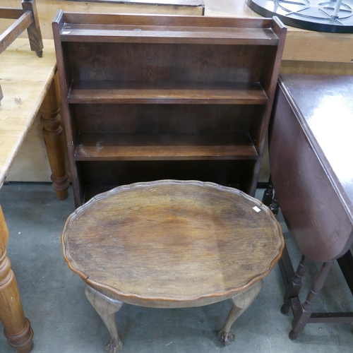 225 - An oak open bookcase, a gateleg table, a walnut coffee table and an embroidered fire screen