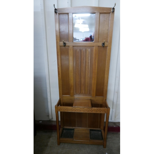 234 - A carved oak linenfold hallstand