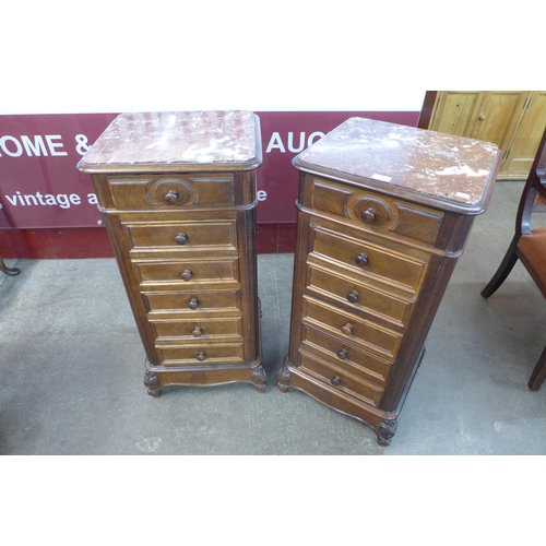 24 - A pair of 19th Century French mahogany and marble topped table de nuits