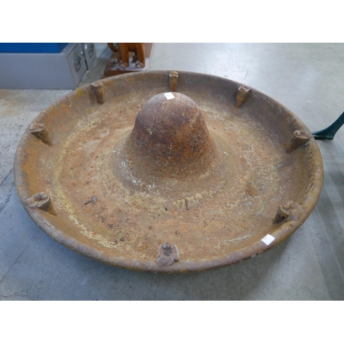 248 - A cast iron Mexican hat pig feeder