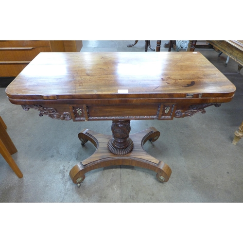 25 - A Regency mahogany D-shaped fold-over pedestal games table