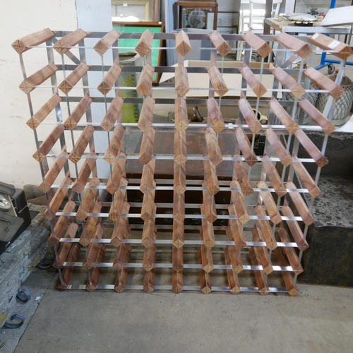 251 - A sixty-four bottle wine rack