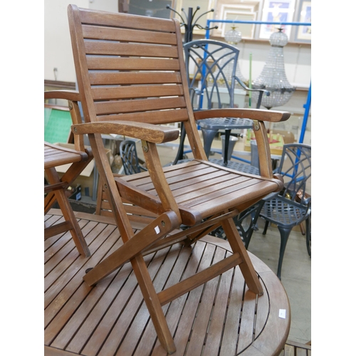 268 - A teak folding garden table and six chairs