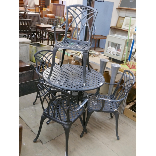 269 - A cast metal garden table and four chairs