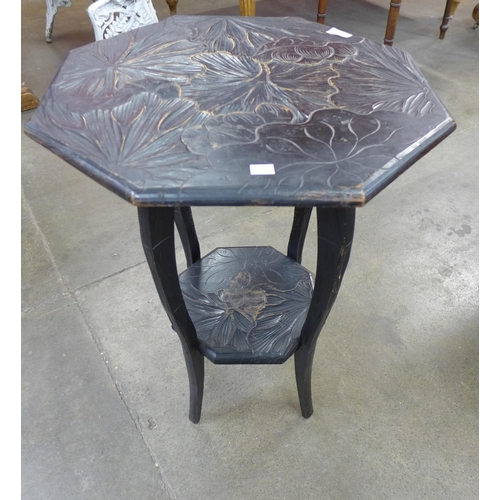 29 - An Arts and Crafts Liberty  & Co. carved ebonised Japanese range octagonal occasional table