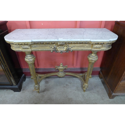 3 - A French Louis XV style carved giltwood and marble topped console table