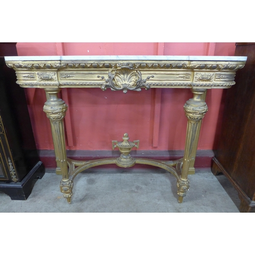 3 - A French Louis XV style carved giltwood and marble topped console table