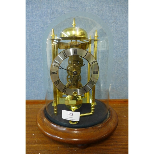 302 - A Sewills of Liverpool brass skeleton clock