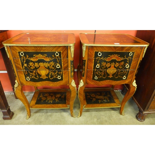 31 - A pair of French Louis XV style mahogany and marquetry effect three drawer gueridon tables