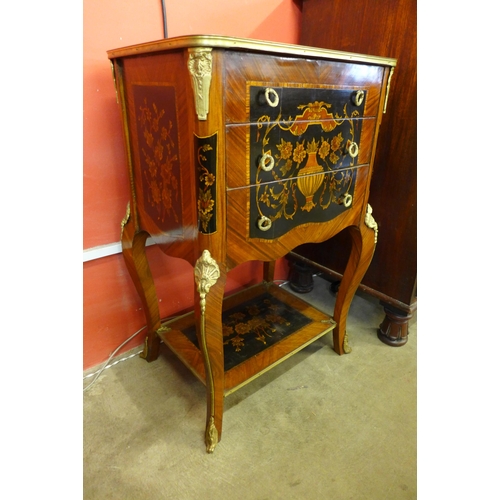 31 - A pair of French Louis XV style mahogany and marquetry effect three drawer gueridon tables