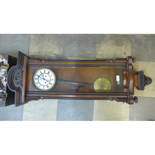 323 - A 19th Century walnut double weight Vienna wall clock