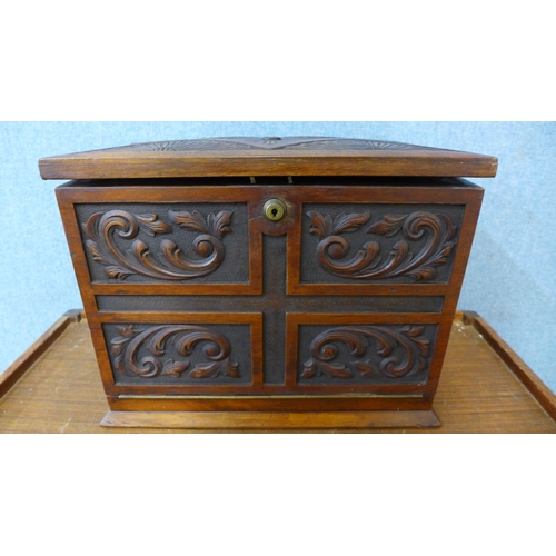 337 - A Victorian carved walnut stationery cabinet/writing slope