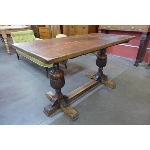 35 - A 17th Century style carved oak refectory table