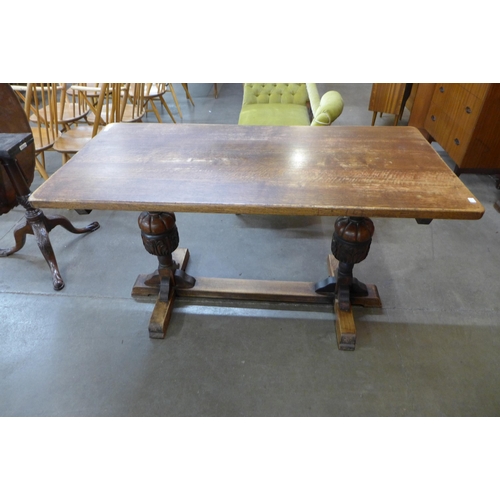 35 - A 17th Century style carved oak refectory table