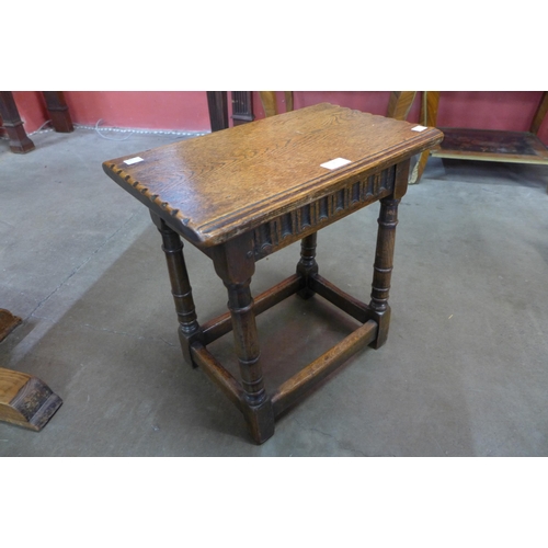 36 - A 17th Century style carved oak joint stool