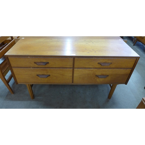 48 - A teak four drawer sideboard