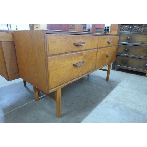 48 - A teak four drawer sideboard