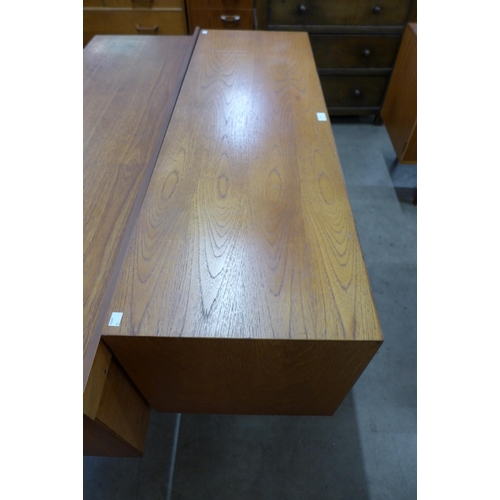 48 - A teak four drawer sideboard