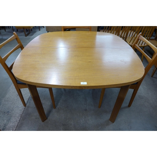 58 - A G-Plan Sierra teak extending dining table and six chairs