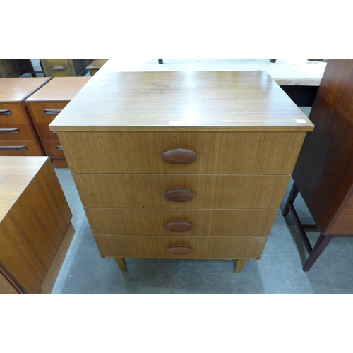 64 - A teak chest of drawers