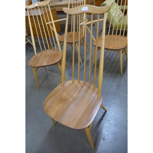 68 - A set of four Ercol Blonde elm and beech Goldsmith chairs