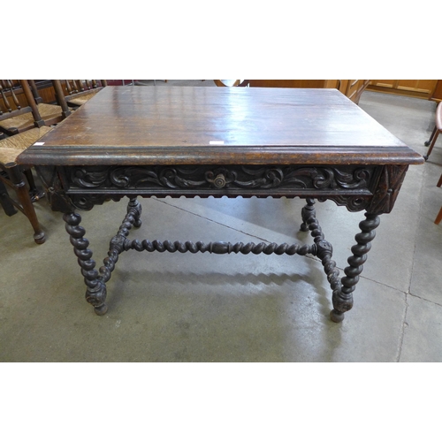 7 - A 19th Century French carved oak barleytwist single drawer writing table