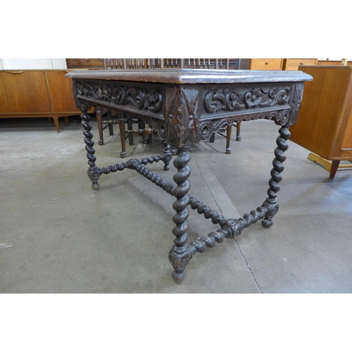 7 - A 19th Century French carved oak barleytwist single drawer writing table