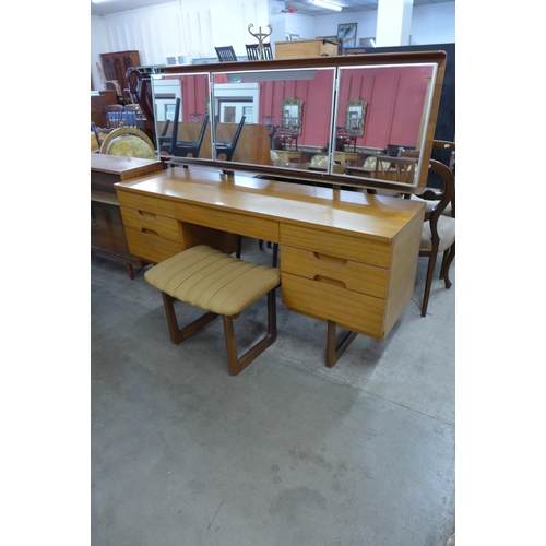 82 - A Uniflex teak dressing table and stool