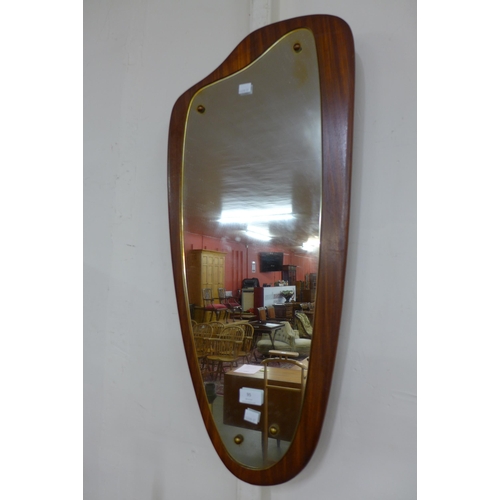 95 - A teak asymmetrical framed mirror