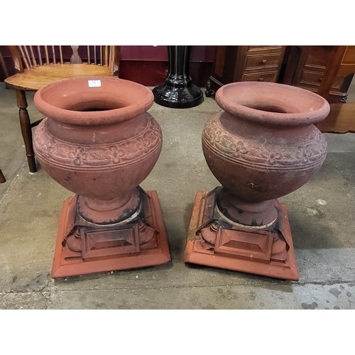 243 - A pair of early 20th Century Arts and Crafts Hathern Station Co. Ltd. terracotta garden urns