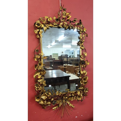 1 - A French gilt metal floral framed mirror