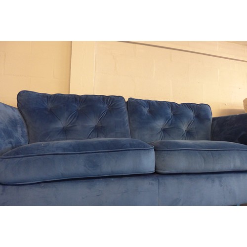 1532 - A Hoxton blue velvet three seater sofa, damaged