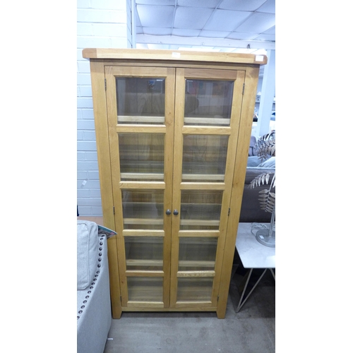 1378 - A Manor oak and glass display unit, missing one glass shelf