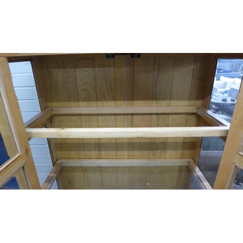 1378 - A Manor oak and glass display unit, missing one glass shelf