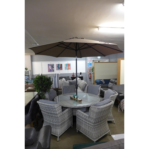 1381 - A seven piece rattan garden dining set with glass table top and cantilever parasol