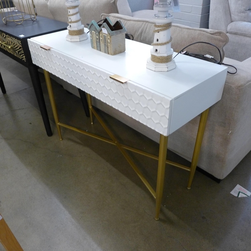 1401 - A white console table with gold legs