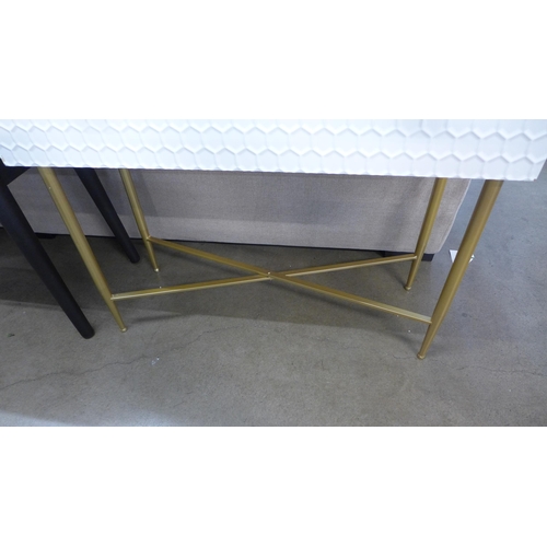 1401 - A white console table with gold legs