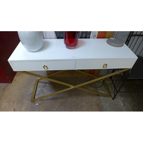 1413 - A white two drawer console table with gold legs