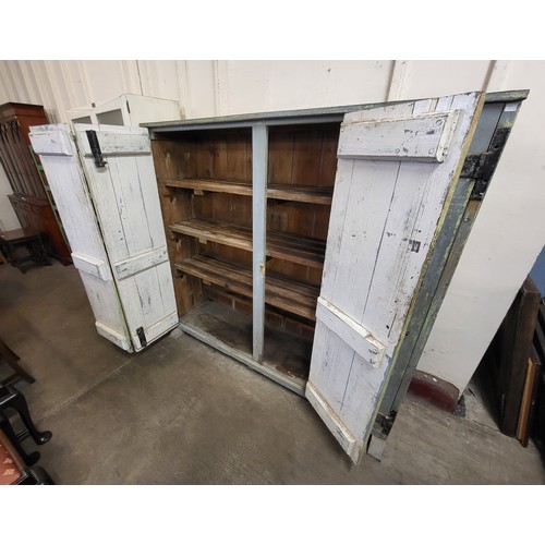 228 - A rustic French painted pine bi-fold two door housekeepers cupboard