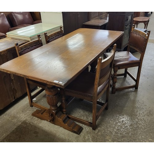 216 - A 17th Century style carved oak six piece dining suite, comprising; refectory table, four chairs and... 