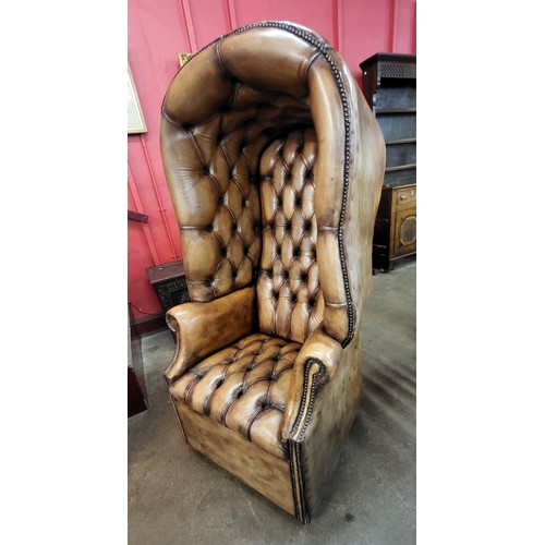 66 - A Regency style brown leather hall porter's chair